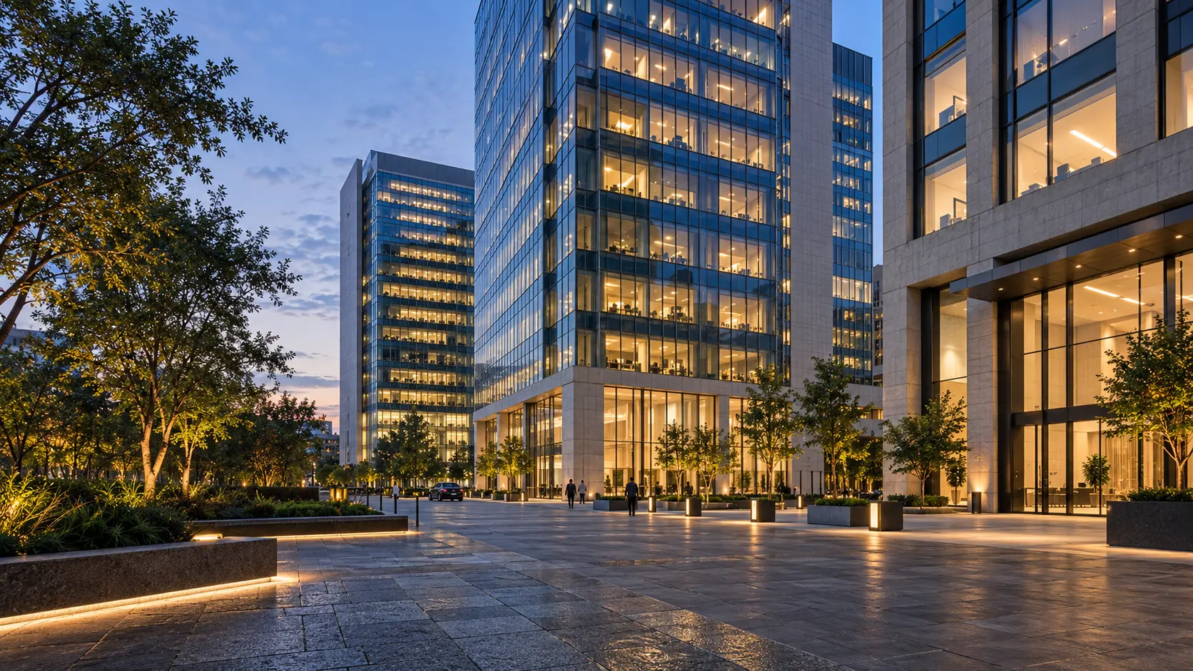 A generic corporate district of lit office towers at dusk